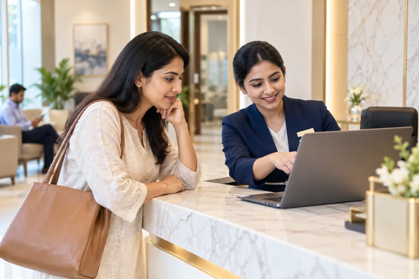 Visitor and receptionist locating a clinic service page.